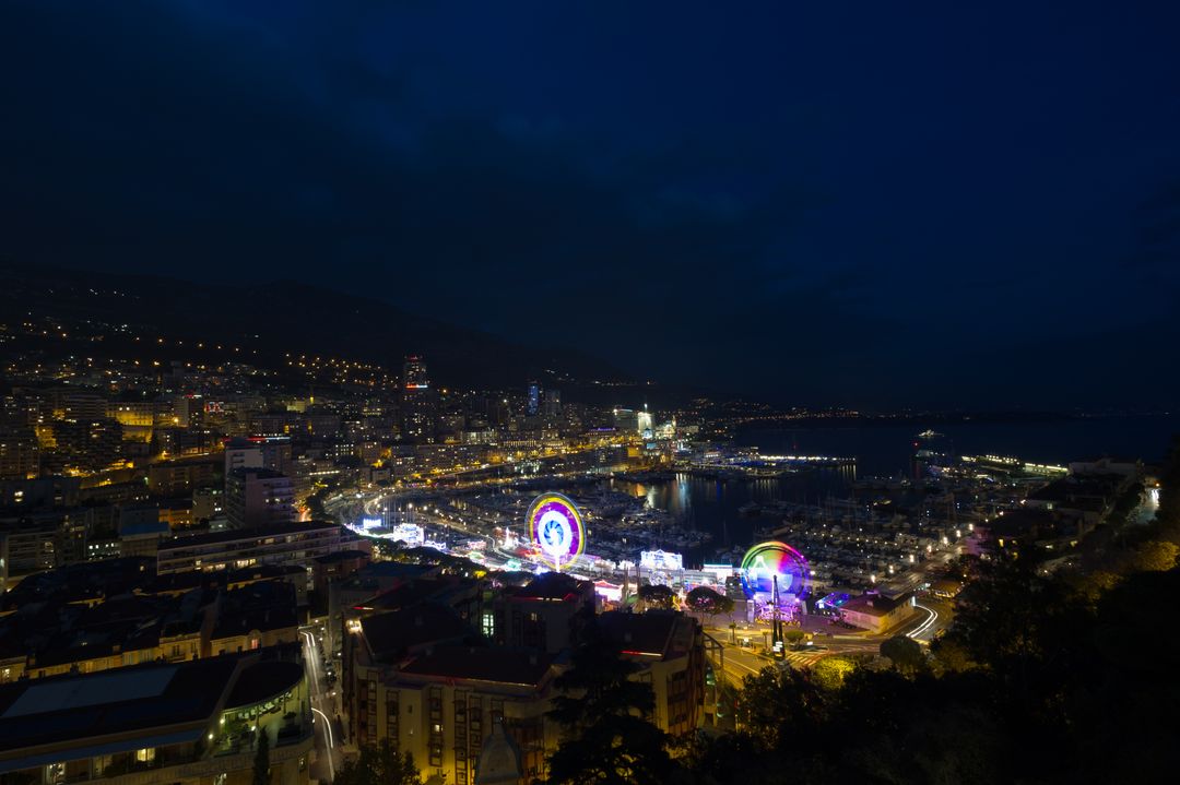 Stunning Nighttime View of Amusement Park by Harbor - Free Images, Stock Photos and Pictures on Pikwizard.com