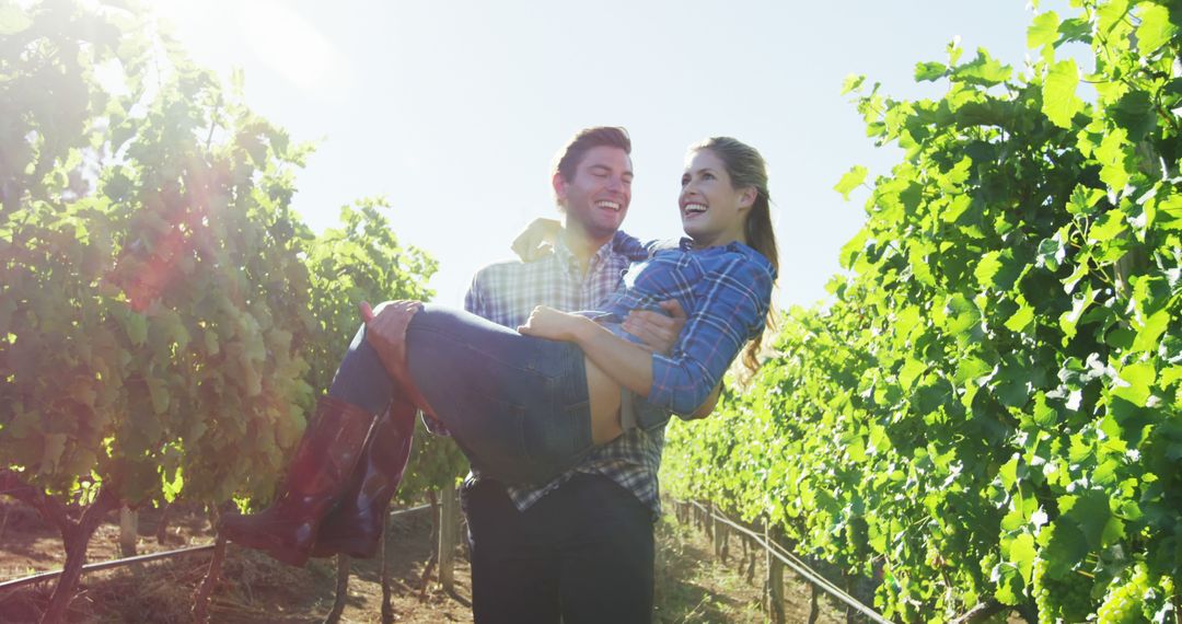 Happy Couple Enjoying Vineyard on Sunny Day