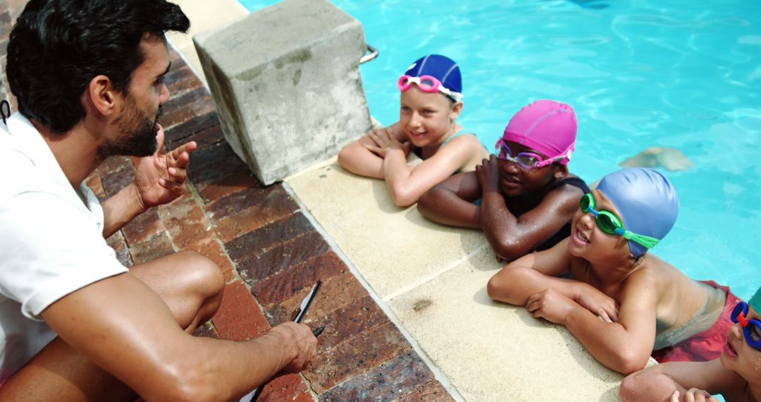 Diverse Children Receiving Swimming Lesson Instruction Poolside - Free Images, Stock Photos and Pictures on Pikwizard.com