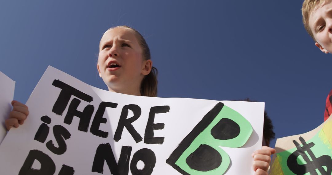 Youth Climate Protest with Earth Awareness Sign - Free Images, Stock Photos and Pictures on Pikwizard.com