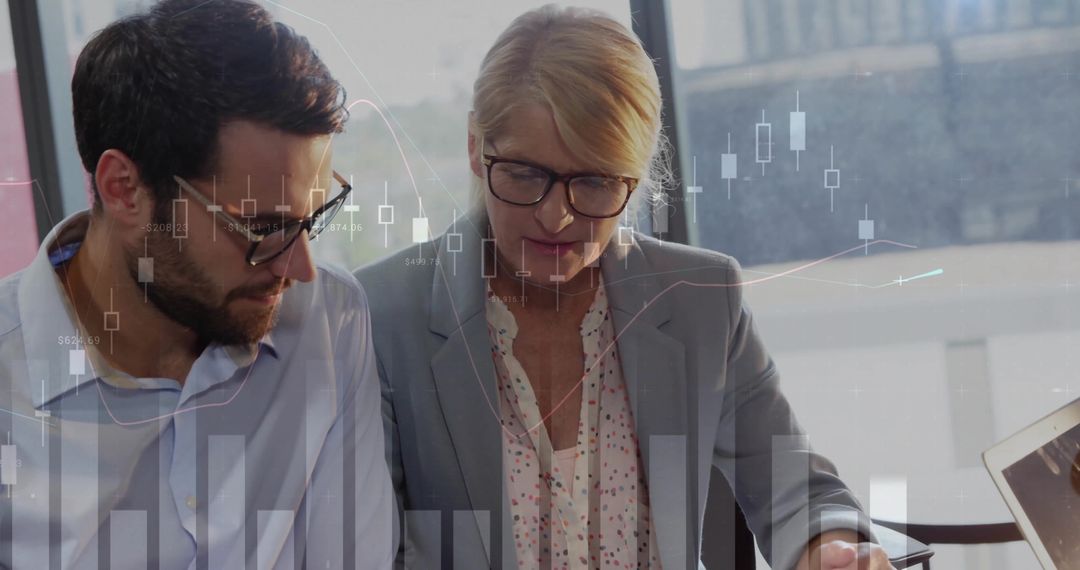 Business Professionals Reviewing Financial Charts with Data Overlay