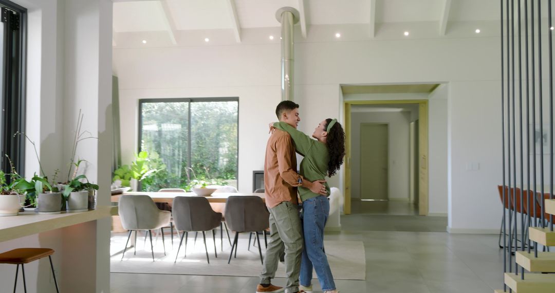 Affectionate Couple Swaying in Modern Open-Plan Home