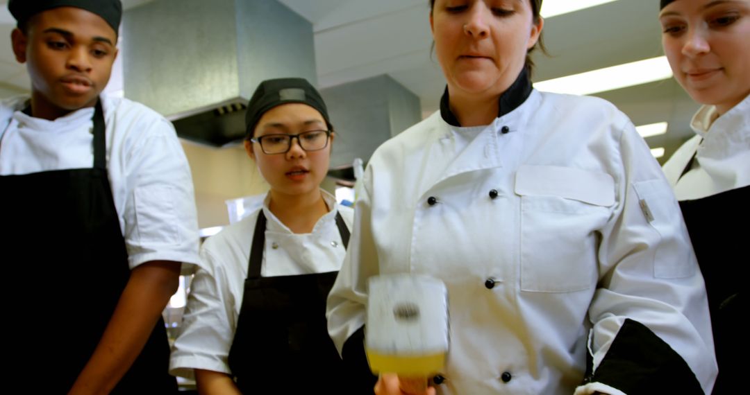 Culinary Students Receiving Training in Professional Kitchen - Free Images, Stock Photos and Pictures on Pikwizard.com