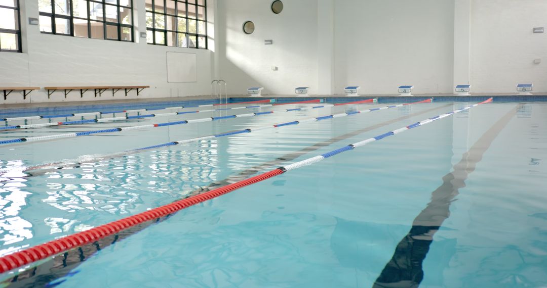 Empty Indoor Swimming Pool with Lane Dividers for Training and Competition