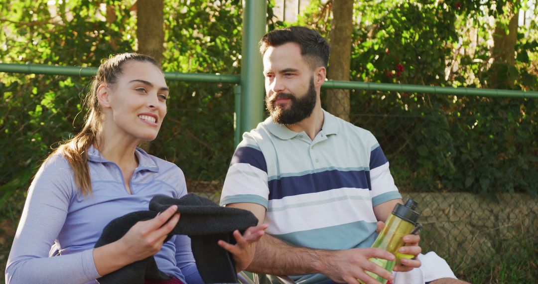 Image of happy caucasian couple on having break the court - Free Images, Stock Photos and Pictures on Pikwizard.com