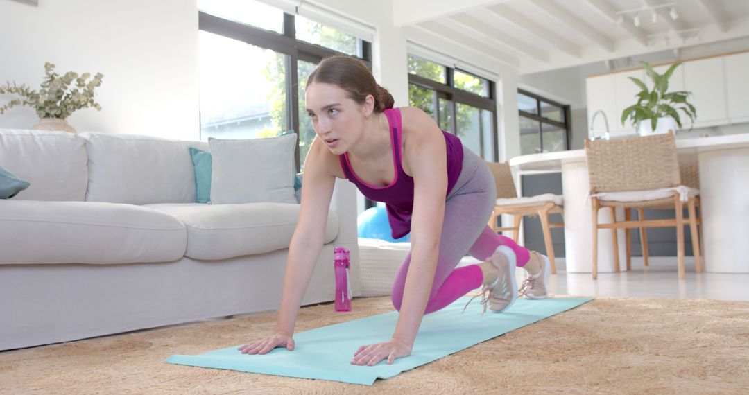 Focused Woman Practicing Yoga in Bright Living Room - Free Images, Stock Photos and Pictures on Pikwizard.com