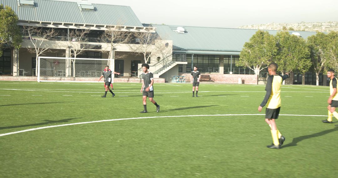 Soccer Players Strategizing Before School Game on Sunny Day