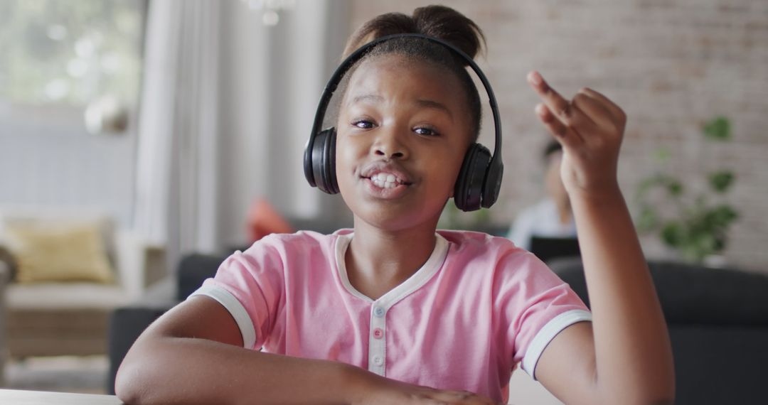 Happy African American Girl Enjoying Music with Headphones at Home - Free Images, Stock Photos and Pictures on Pikwizard.com