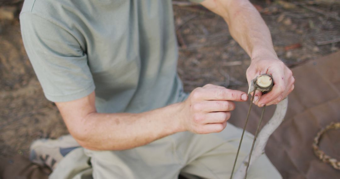 Man Creating Traditional Bow String for Archery - Free Images, Stock Photos and Pictures on Pikwizard.com