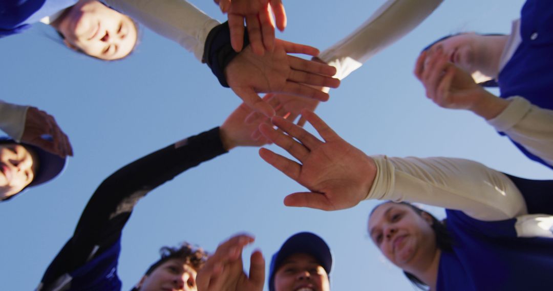 Team Celebrating Victory with Hands In Huddle - Free Images, Stock Photos and Pictures on Pikwizard.com