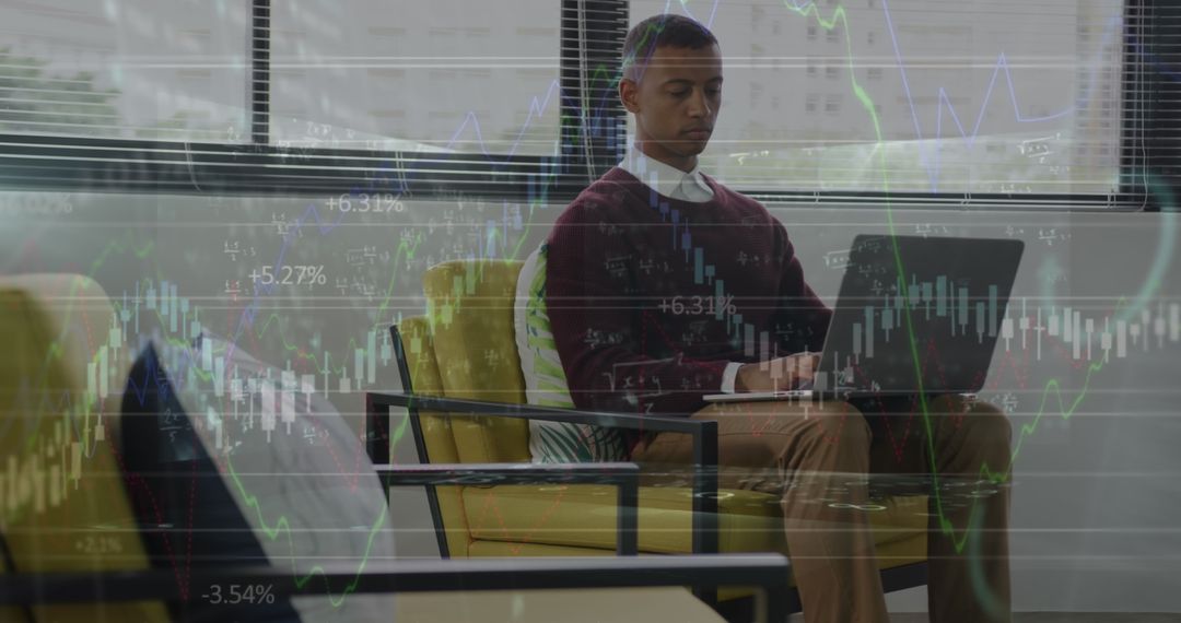 Businessman Analyzing Financial Data on Laptop