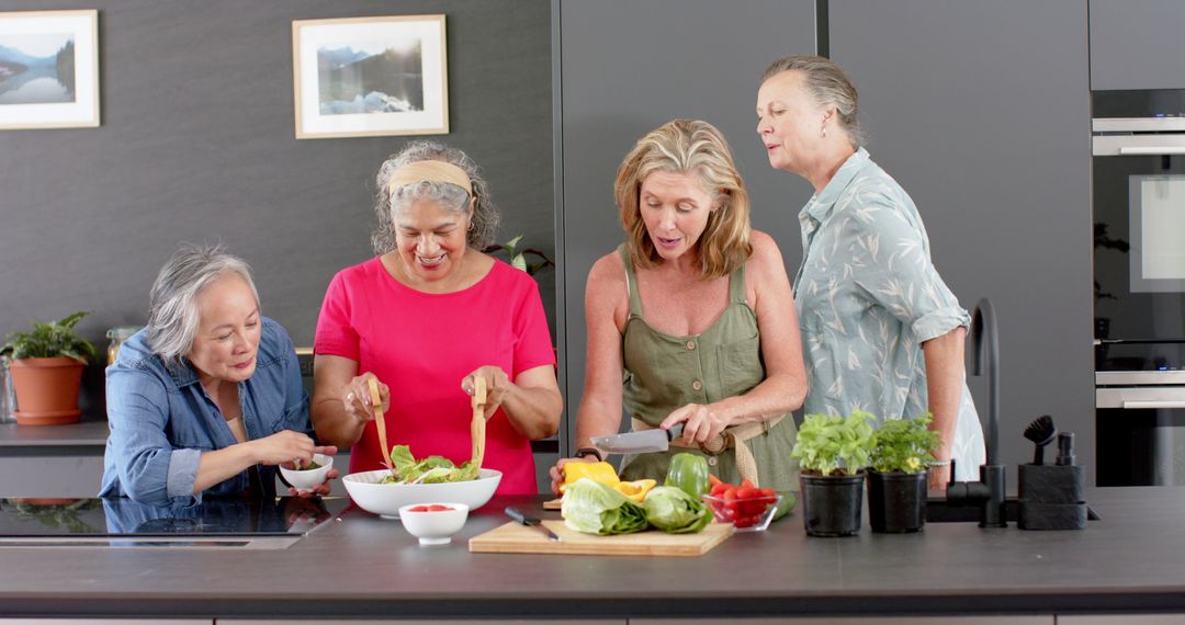 Joyful Diverse Seniors Group Preparing Salad Together in Modern Kitchen
