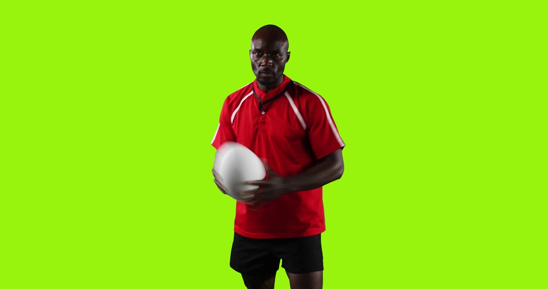 Rugby Player Holding Ball Against Green Screen Background - Free Images, Stock Photos and Pictures on Pikwizard.com