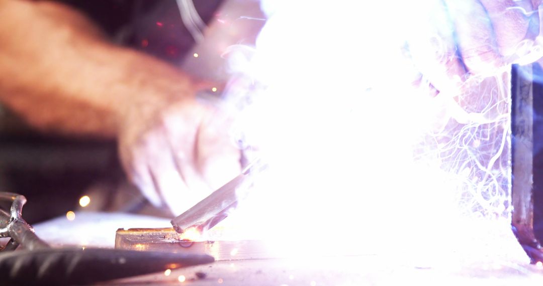 Close Up of Hands Welding Metal with Bright Sparks - Free Images, Stock Photos and Pictures on Pikwizard.com