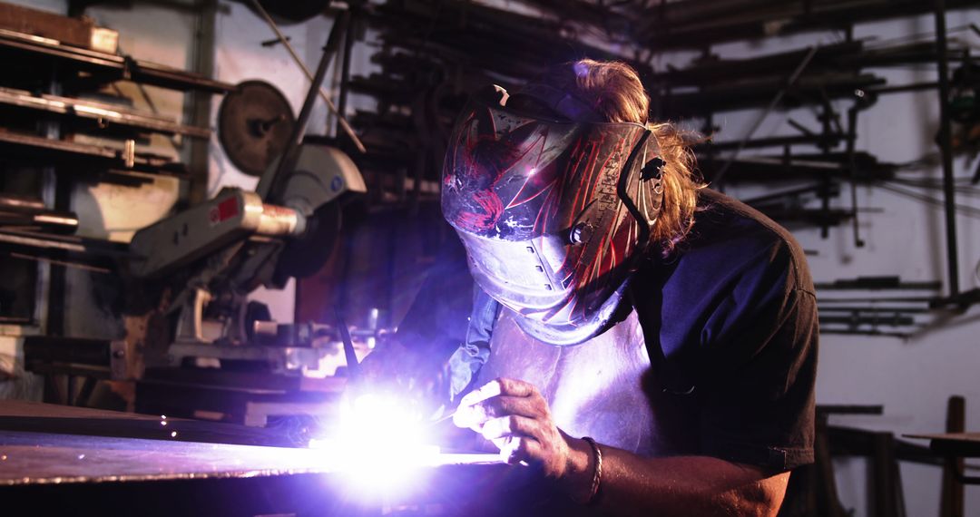 Male Welder Working in Industrial Workshop with Bright Welding Sparks - Free Images, Stock Photos and Pictures on Pikwizard.com