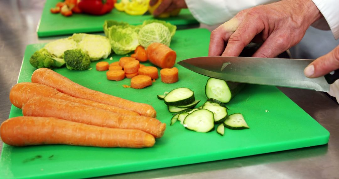 Chef Slicing Fresh Vegetables in Kitchen - Free Images, Stock Photos and Pictures on Pikwizard.com