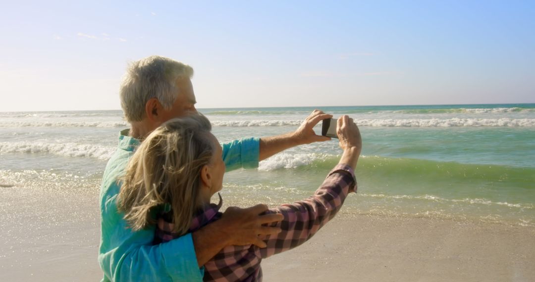Senior Couple Enjoying Beach Selfie on Relaxed Vacation