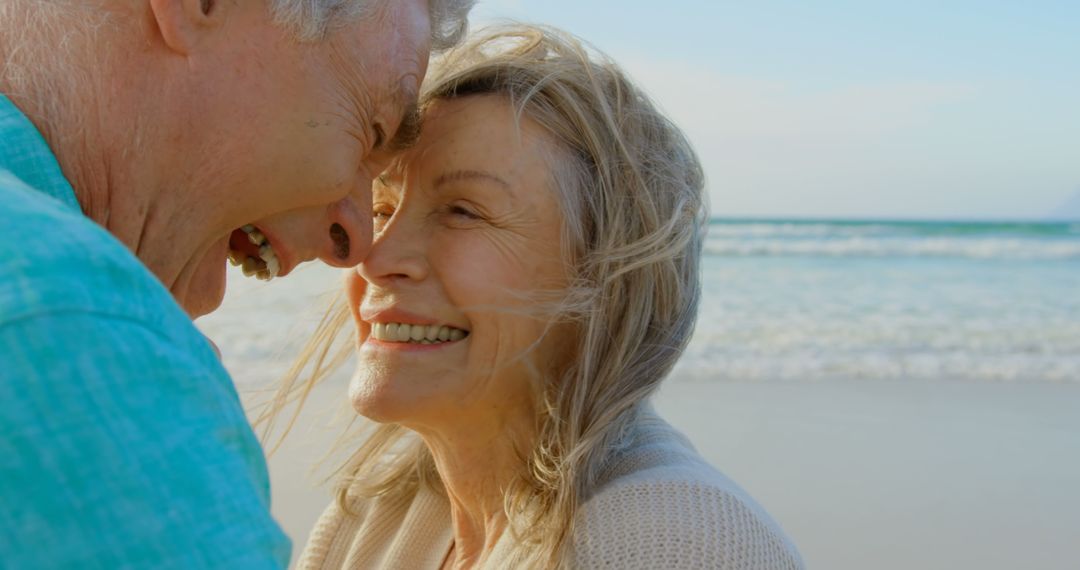 Senior Couple Embracing Lovingly on Beachside Getaway