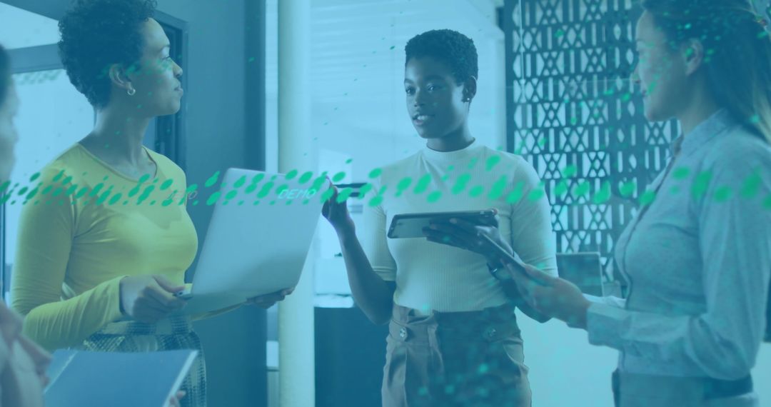 Diverse Colleagues Engaged in Office Discussion on Financial Data