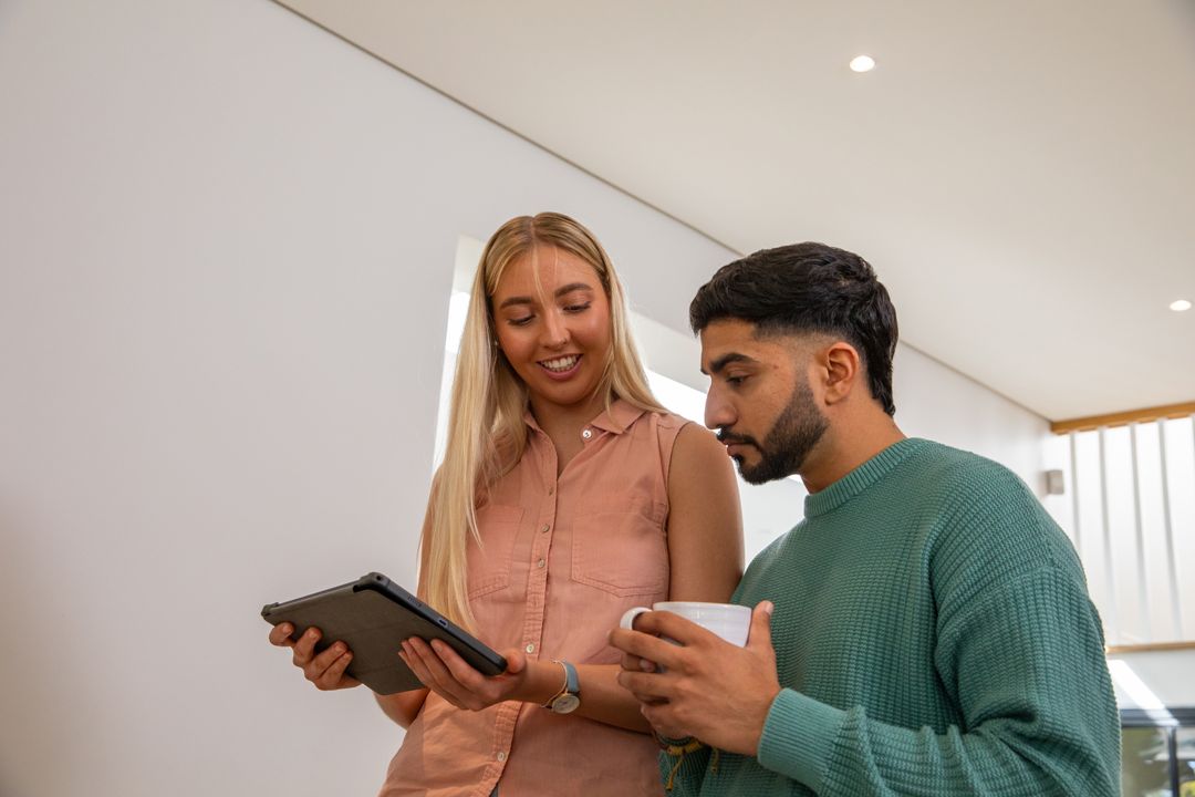 Collaborative Office Meeting with Tablet and Coffee