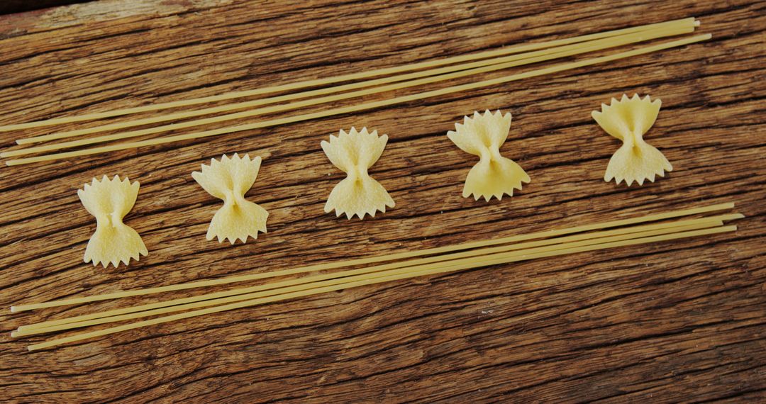 Assorted Pasta Arranged in Rows on Rustic Wooden Surface - Free Images, Stock Photos and Pictures on Pikwizard.com