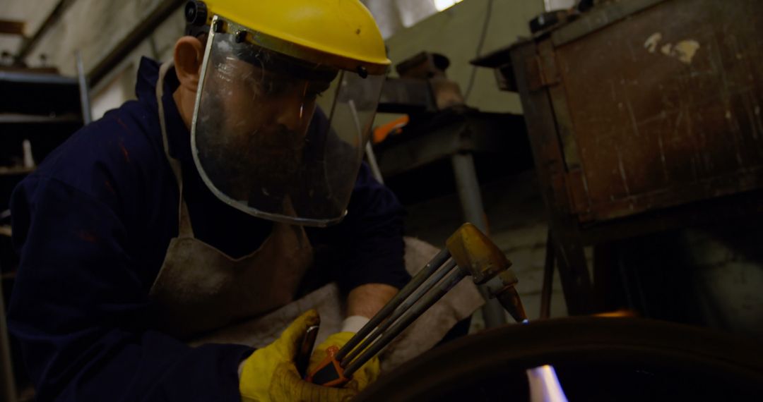 Industrial Worker Welding Metal with Protective Gear in Workshop - Free Images, Stock Photos and Pictures on Pikwizard.com