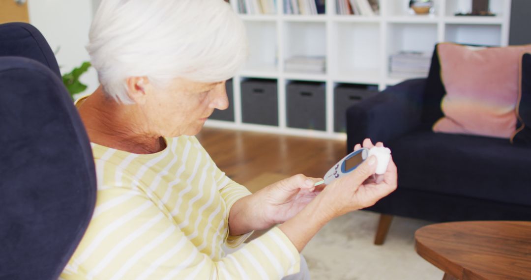 Senior Woman Monitoring Glucose Level at Home - Free Images, Stock Photos and Pictures on Pikwizard.com