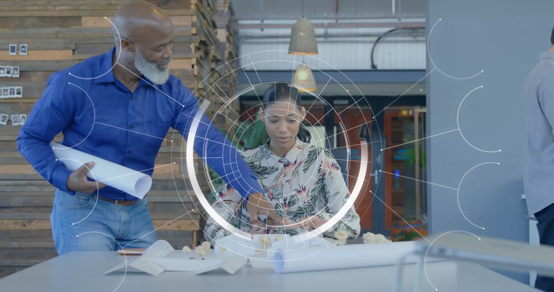 Diverse Team Analyzing Data with Futuristic Interfaces in Modern Office