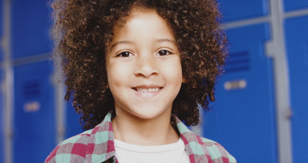Smiling Biracial Child in School Hallway Happiness and Learning