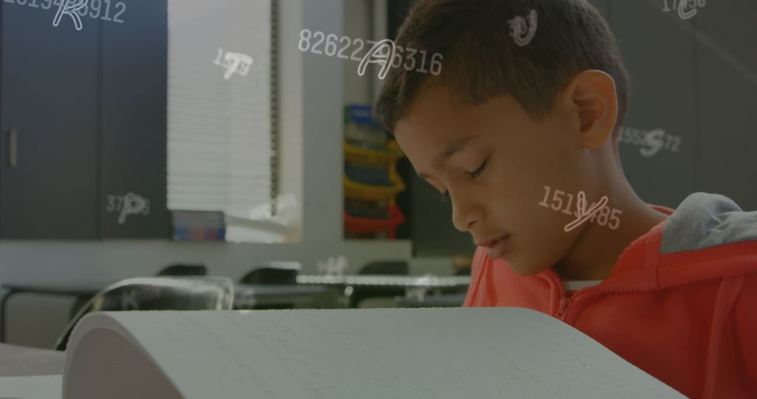 Young Boy Reading Braille in Classroom Environment