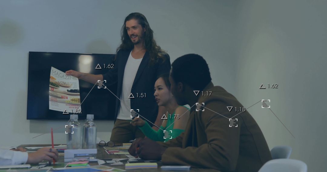 Diverse Team Analyzing Data with Digital Interface in Office Meeting