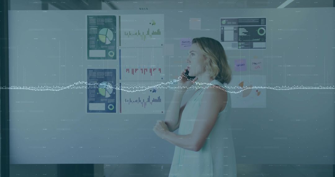 Woman Analyzing Data Insights on Phone in Modern Office