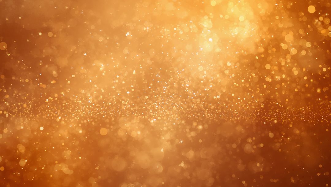 Golden bokeh glitter background with horizontal band of shimmering particles, warm amber glow