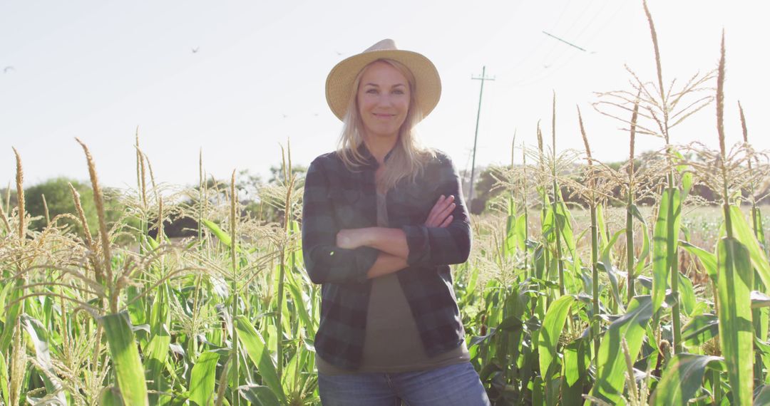 Smiling Female Farmer Standing in Lush Sunlit Cornfield