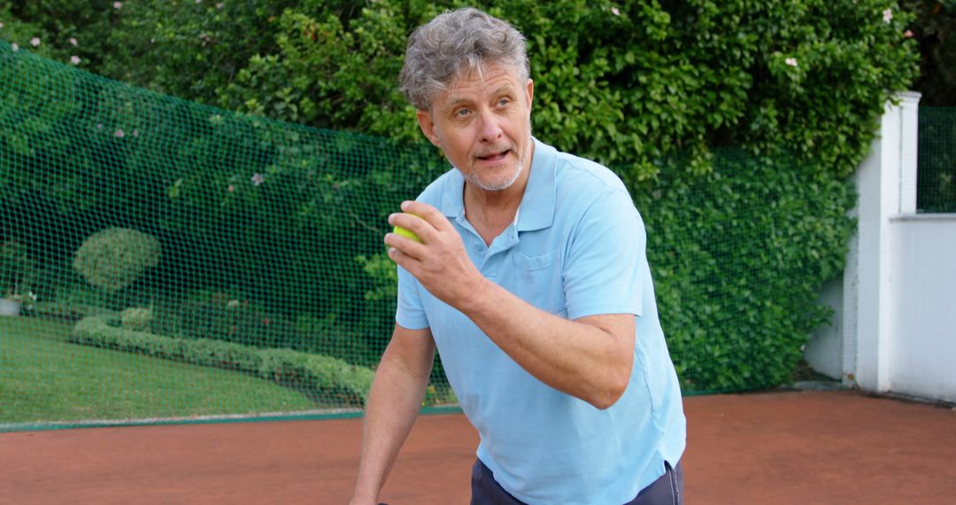 Senior Man Practicing Tennis on Outdoor Court - Free Images, Stock Photos and Pictures on Pikwizard.com