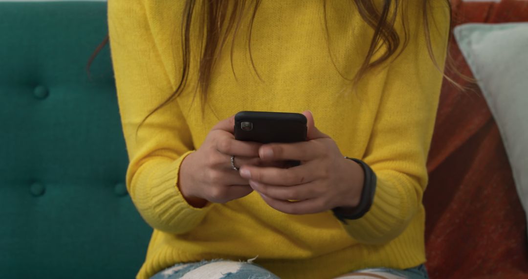 Young Woman Texting on Smartphone in Casual Setting - Free Images, Stock Photos and Pictures on Pikwizard.com