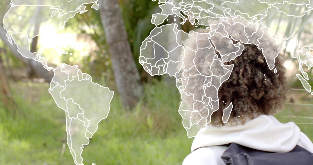 Backpack traveler exploring world map overlay in sunlit forest and meadow for travel planning