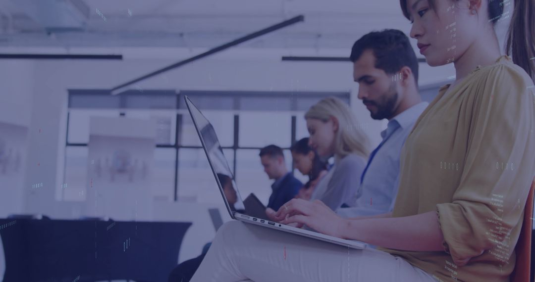 Business Professionals Collaborating Using Technology in Modern Office