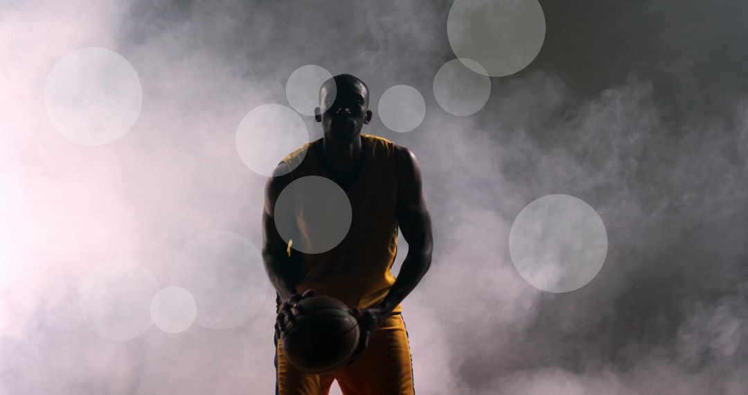 Silhouette of Basketball Player in Action with Dramatic Lighting