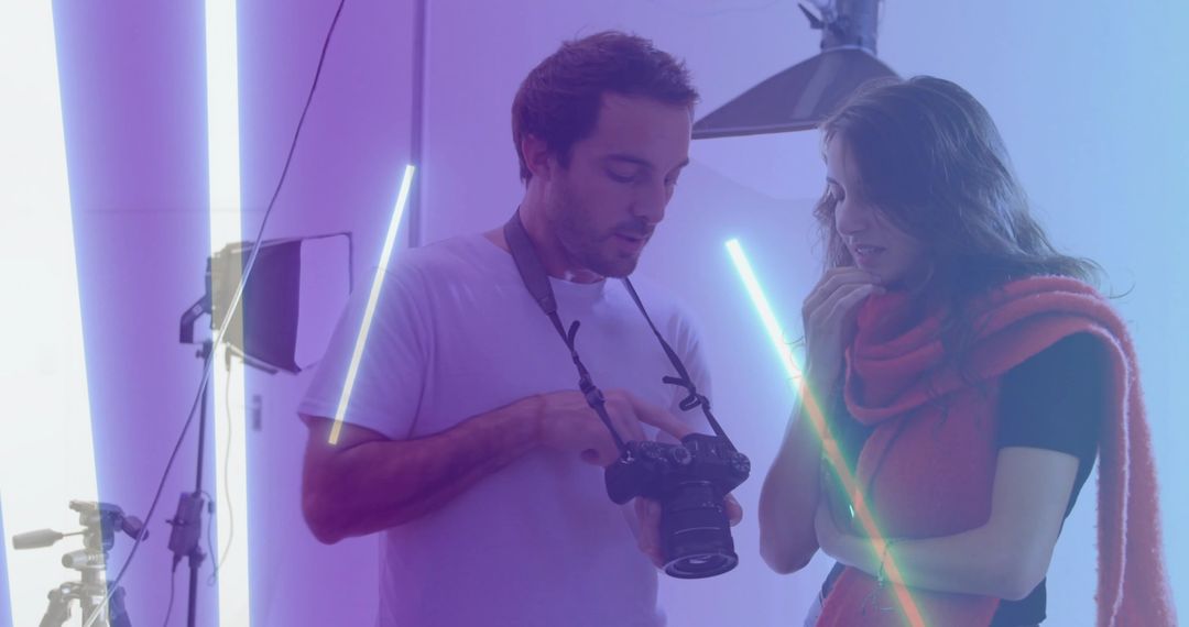 Photographer and Model Reviewing Shots in Creative Studio