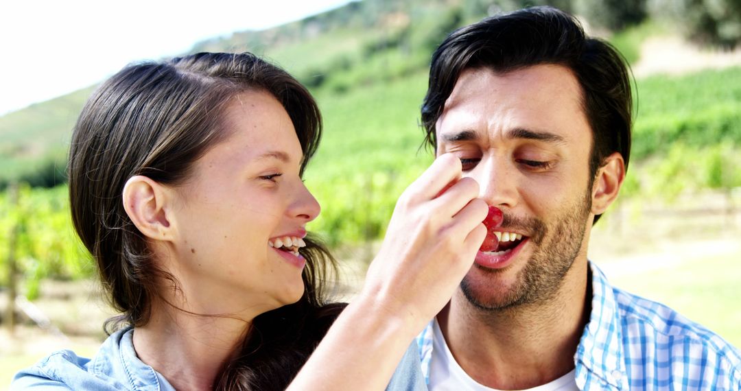 A couple shares a romantic, playful moment in a vineyard. - Free Images, Stock Photos and Pictures on Pikwizard.com