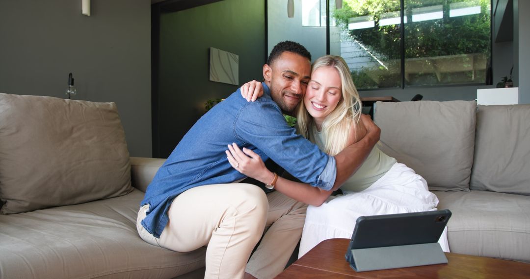 Happy Couple Announcing Engagement via Video Call on Tablet