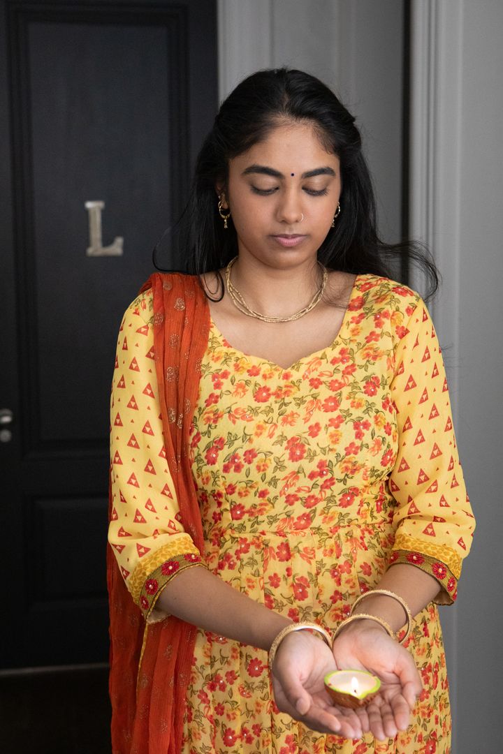Woman Holding Clay Oil Lamp Celebrating Tradition