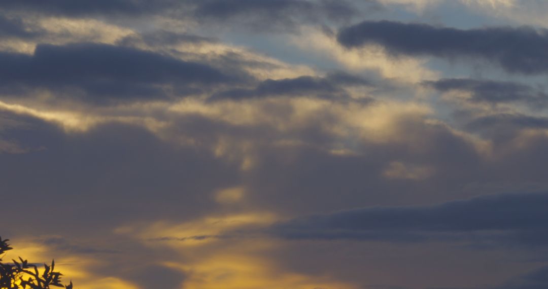 Golden clouds at dawn creating ethereal sky landscape - Free Images, Stock Photos and Pictures on Pikwizard.com