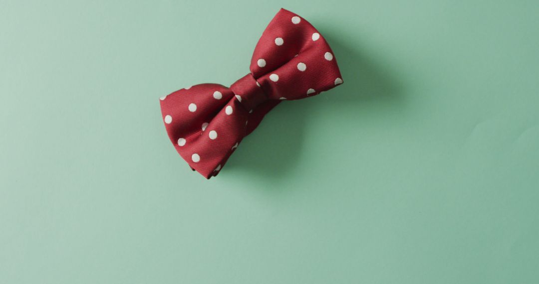 Red Polka Dot Bow Tie on Mint Green Background - Free Images, Stock Photos and Pictures on Pikwizard.com