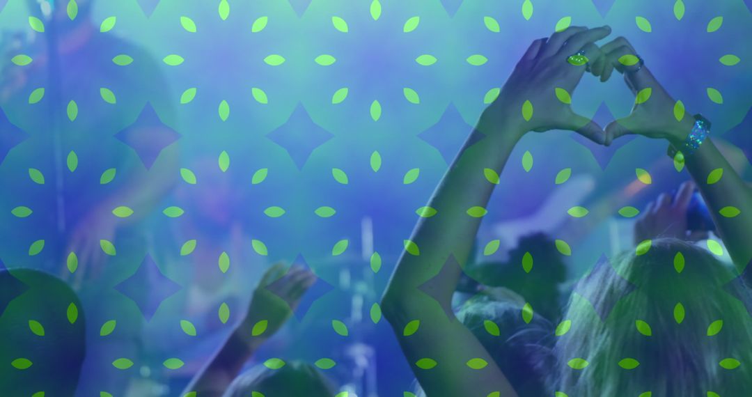 Audience Creating Heart Shapes at Music Festival