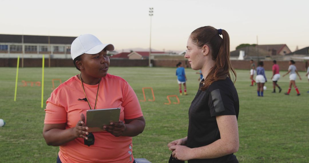 Female Soccer Coach Discussing Strategy During Practice - Free Images, Stock Photos and Pictures on Pikwizard.com