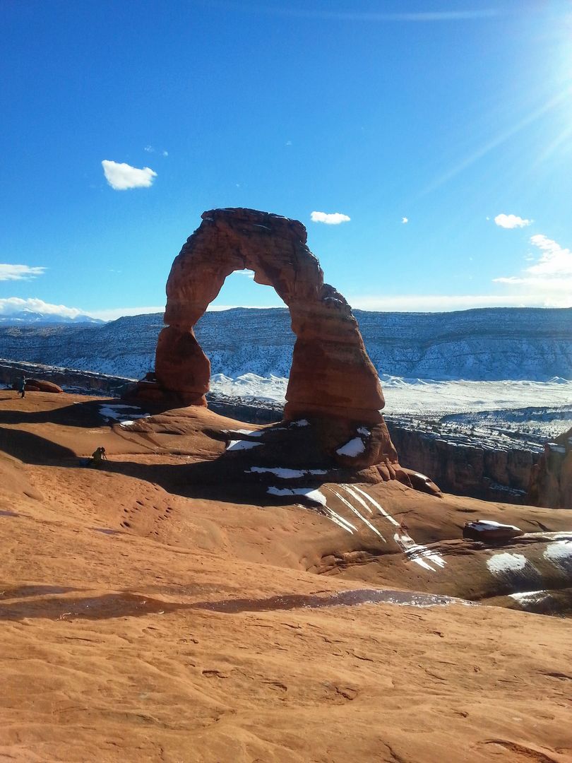 Majestic Delicate Arch in Sunlit Winter Landscape - Free Images, Stock Photos and Pictures on Pikwizard.com