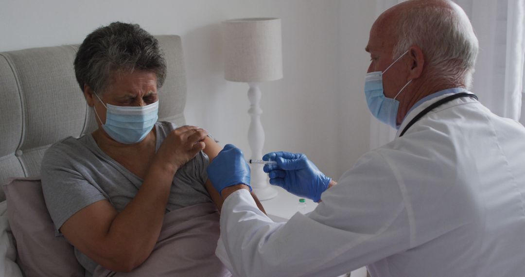 Elderly Woman Receiving Vaccine Injection at Home from Doctor - Free Images, Stock Photos and Pictures on Pikwizard.com