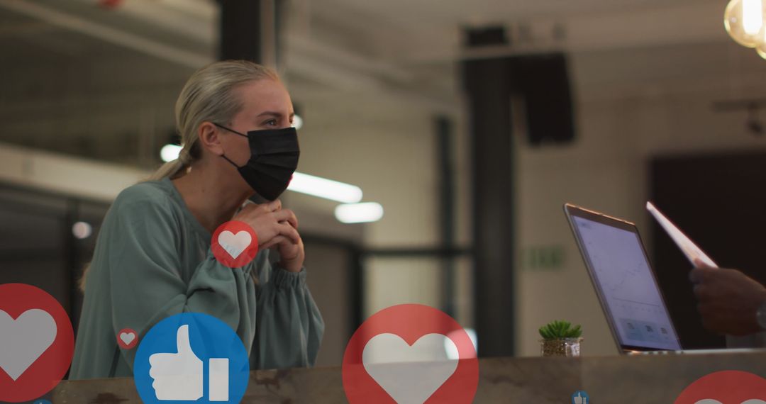 Coworkers Engaging in Social Media Strategy Discussion with Digital Overlay